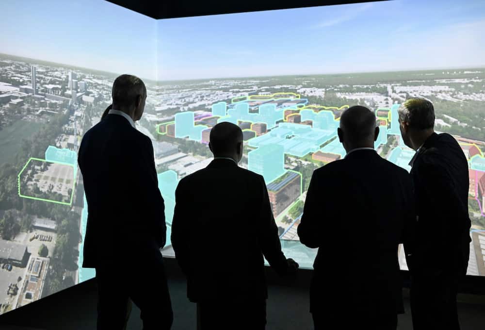 Siemens CEO Roland Busch showed German Chancellor Olaf Scholz and other officials plans for the redevelopment of Siemensstadt Square in Berlin