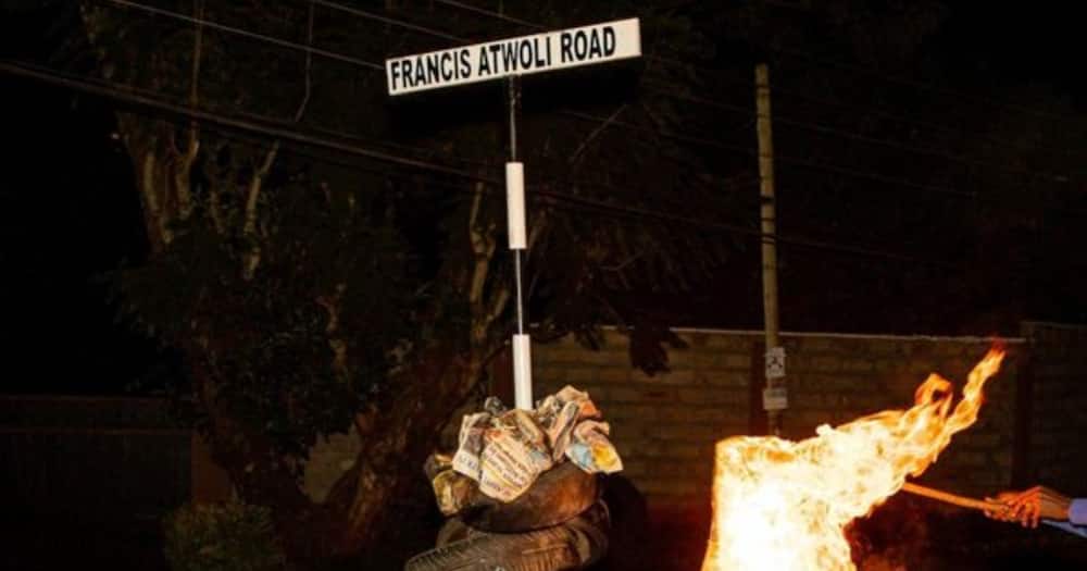 Francis Atwoli's road signage was set ablaze by unknown people using car tyres. Photo: Nelson Havi.