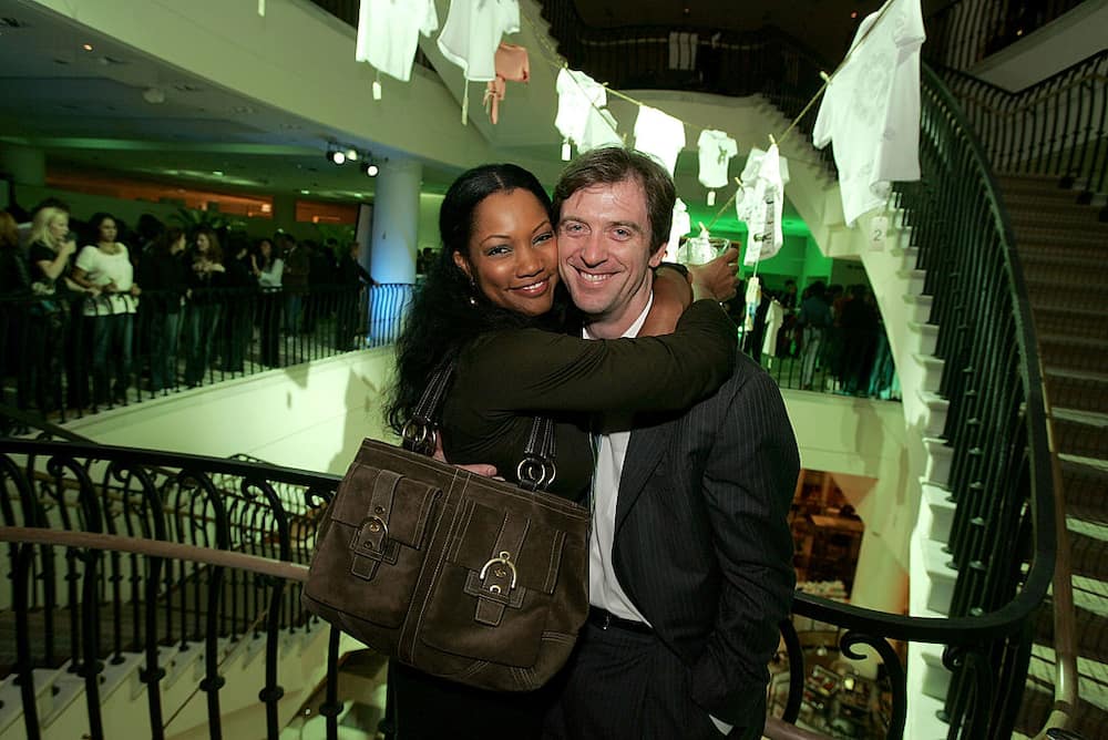 Actress Garcelle Beauvais (L) and her ex-husband Mike Nilon embrace