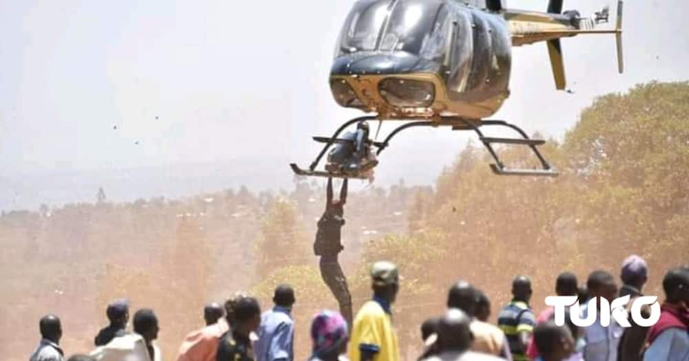 There Was a Scare as 2 Men Hang on Helicopter During Former MP John Serut's Burial.