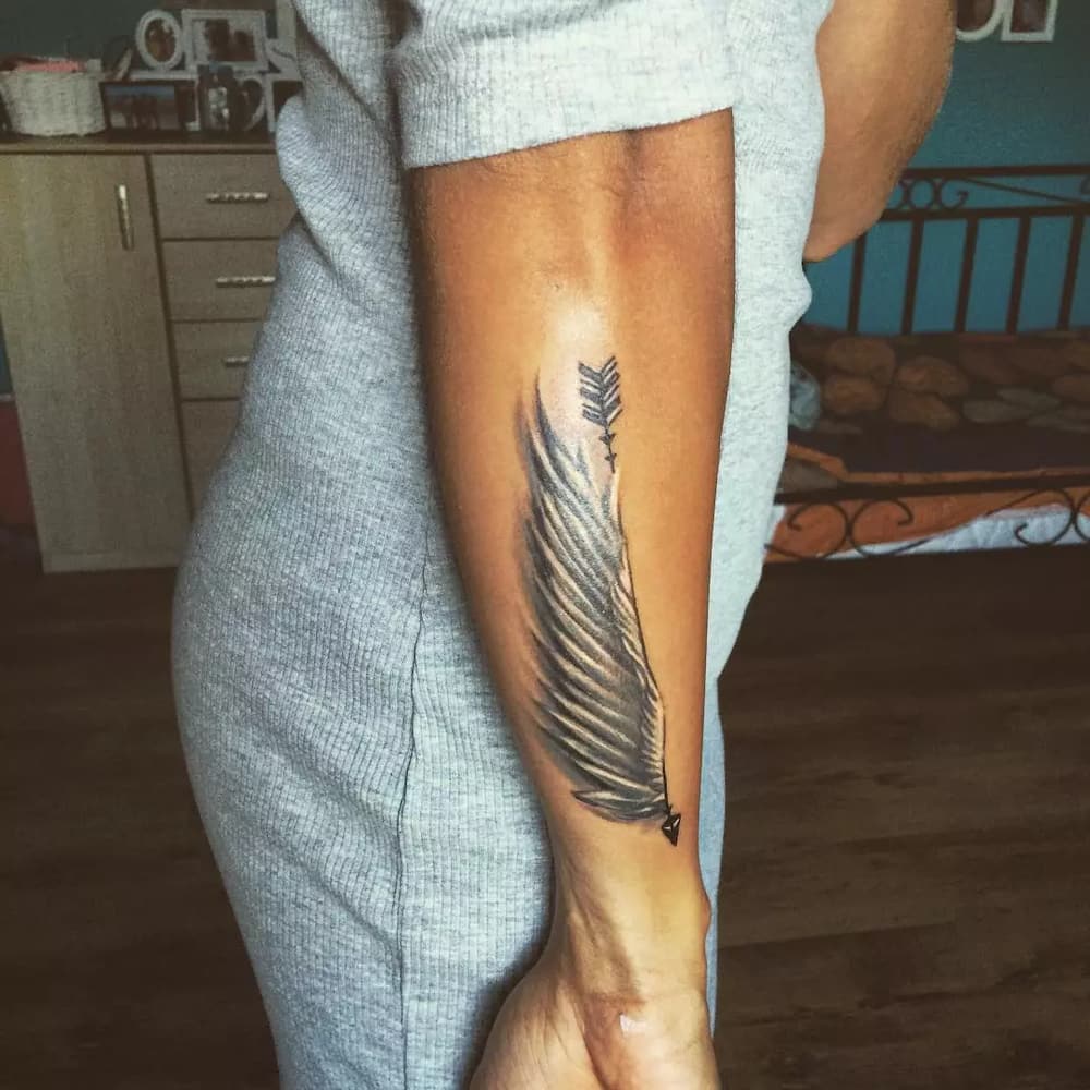 women's outer forearm tattoo