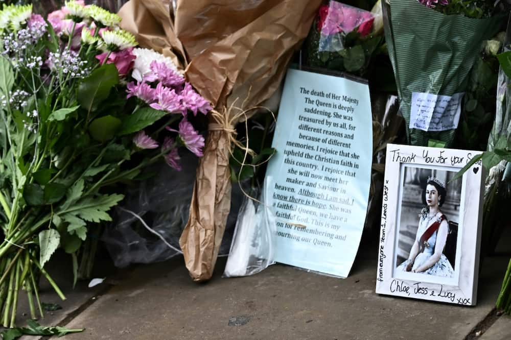 Flowers are piling up outside Elizabeth's London palace, in one of many poignant signs of the genuine reverence felt for her
