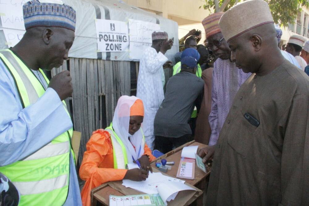 A polling station official registers voters during local elections in Maiduguri on November 28, 2020.