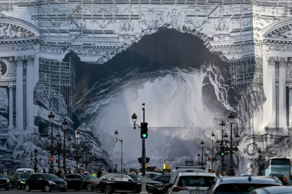 An installation by French artist JR, depicting the philosophical allegory of Plato's cave, covers part of the facade of the Opera Garnier during renovation