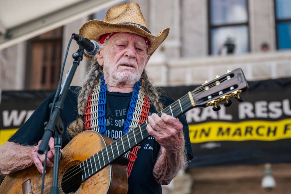 Willie Nelson performing at the Georgetown to Austin March for Democracy rally