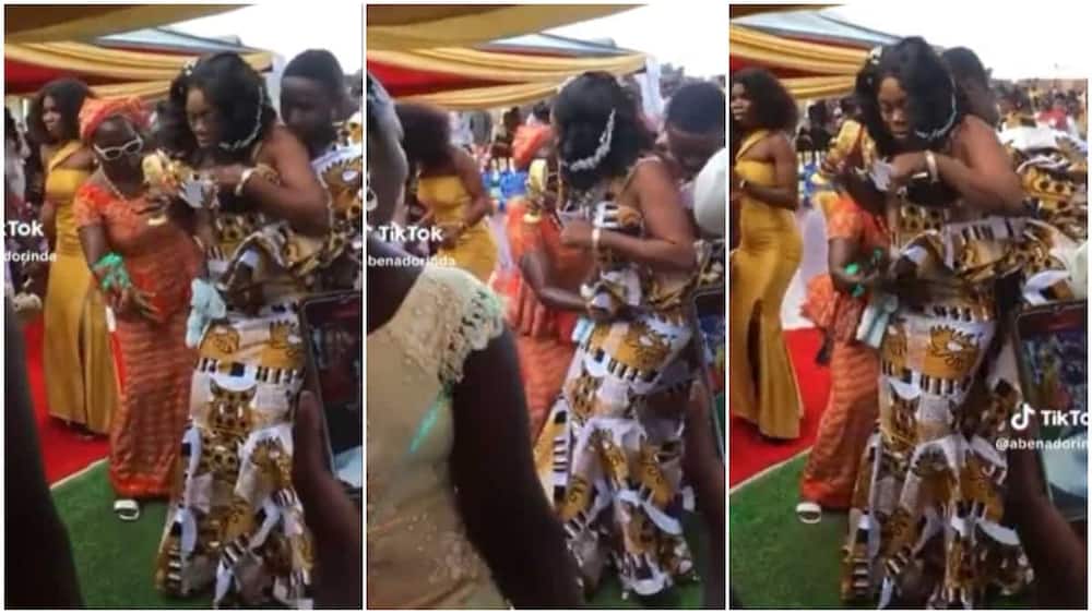 Weddding dance/woman touched bride's stomach.