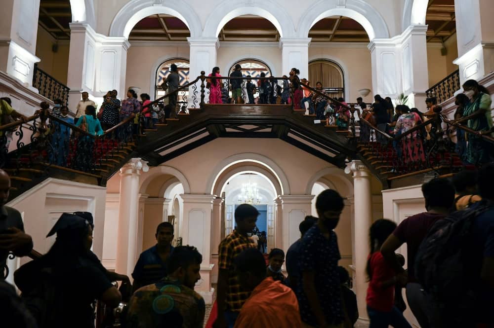 People visit Sri Lankan President Gotabaya Rajapaksa's official residence in Colombo on July 12, 2022, after it was overrun by anti-government protestors on July 9