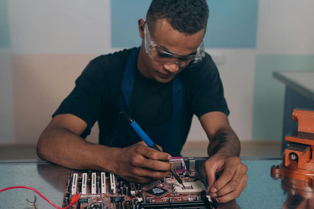 A man fixing an electronic