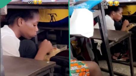 Female Student Hides Under Desk to Eat, Gets Caught in Video