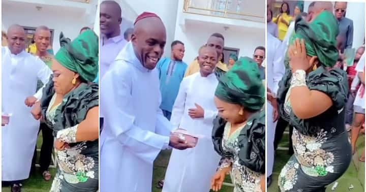 Bishop sprays money, woman dances buga.