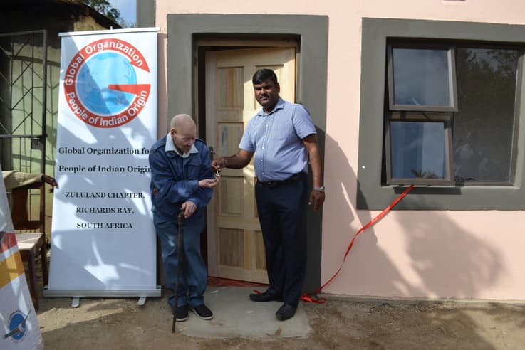 Kind businessman gifts old blind man fully furnished house