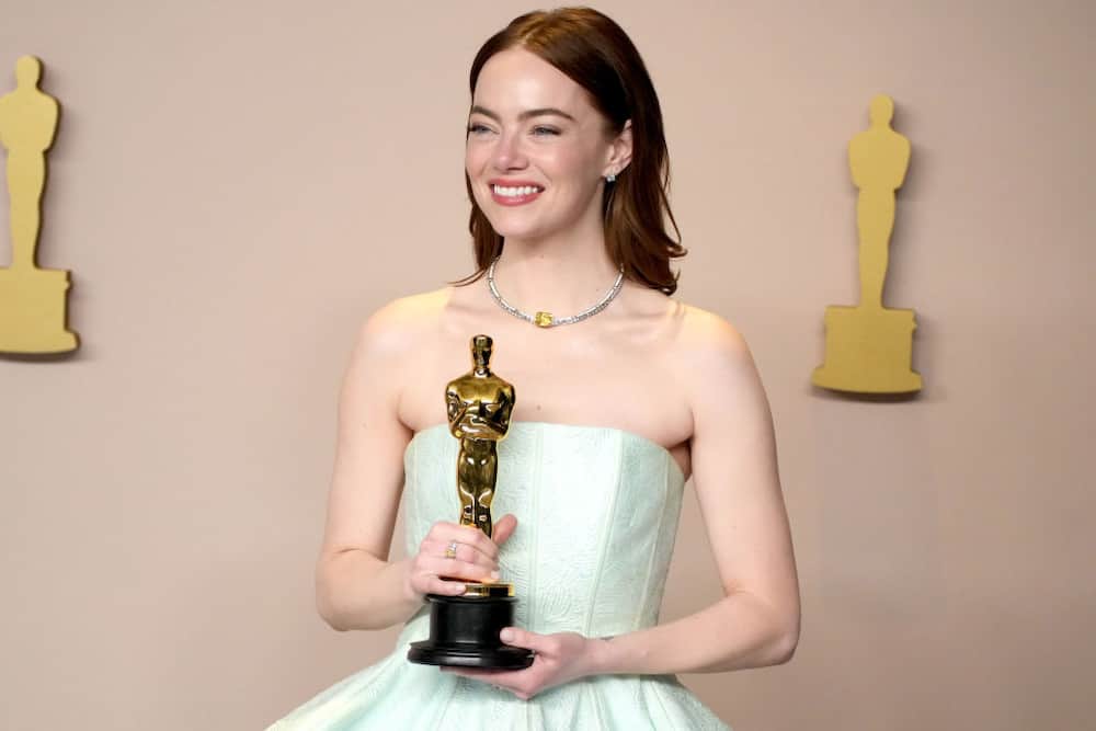 Emma Stone accepting an award during the 96th Annual Academy Awards