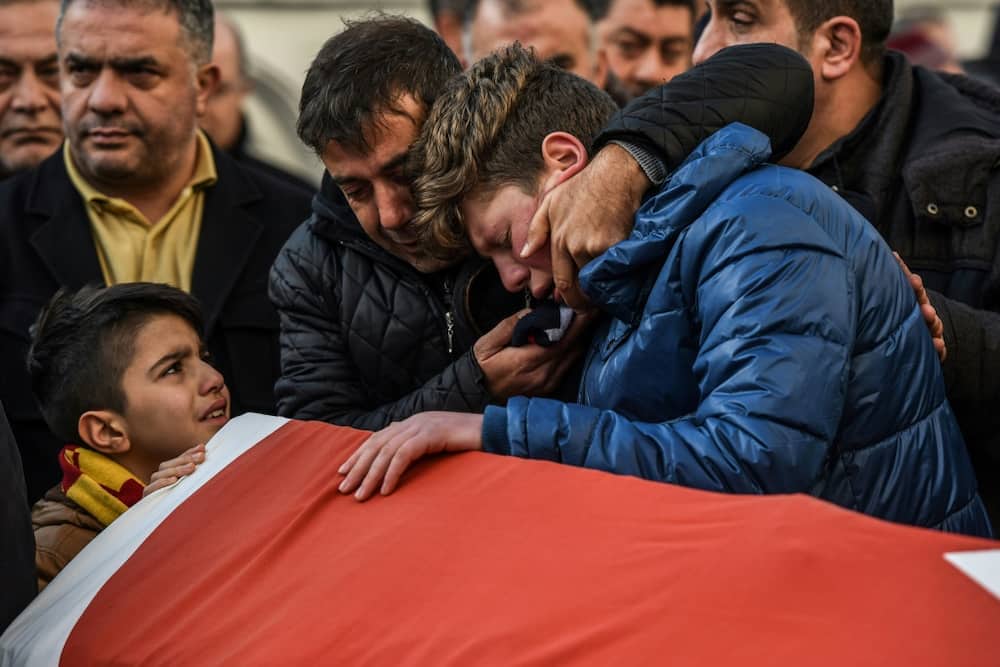 Mourners weep over the casket of one of the victims of a terrorist attack on a nightclub in Istanbul, Turkey, on January 1, 2017
