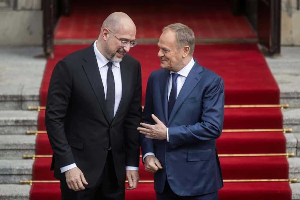Ukrainian Prime Minister Denys Shmyhal (Ukrainian Prime Minister Denys Shmygal (L) said he hoped to have 'pragmatic and constructive' talks with Polish counterpart Donald Tusk (R)   L) said he hope to have 'pragmatic and constructive' talks with Polish counterpart Donald Tusk (R)