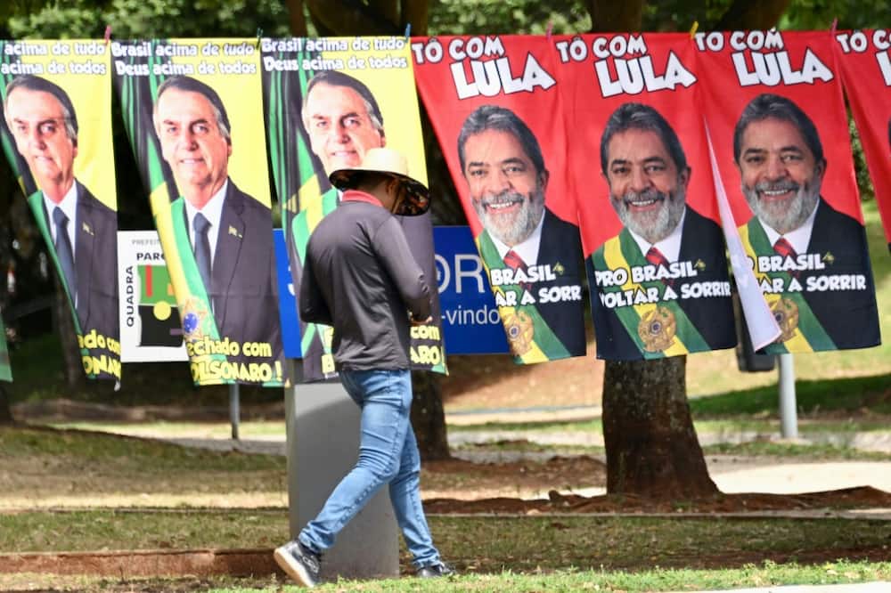 Ex-president Luiz Inacio Lula da Silva (R) and far-right incumbent Jair Bolsonaro are vying for Brazil's presidency