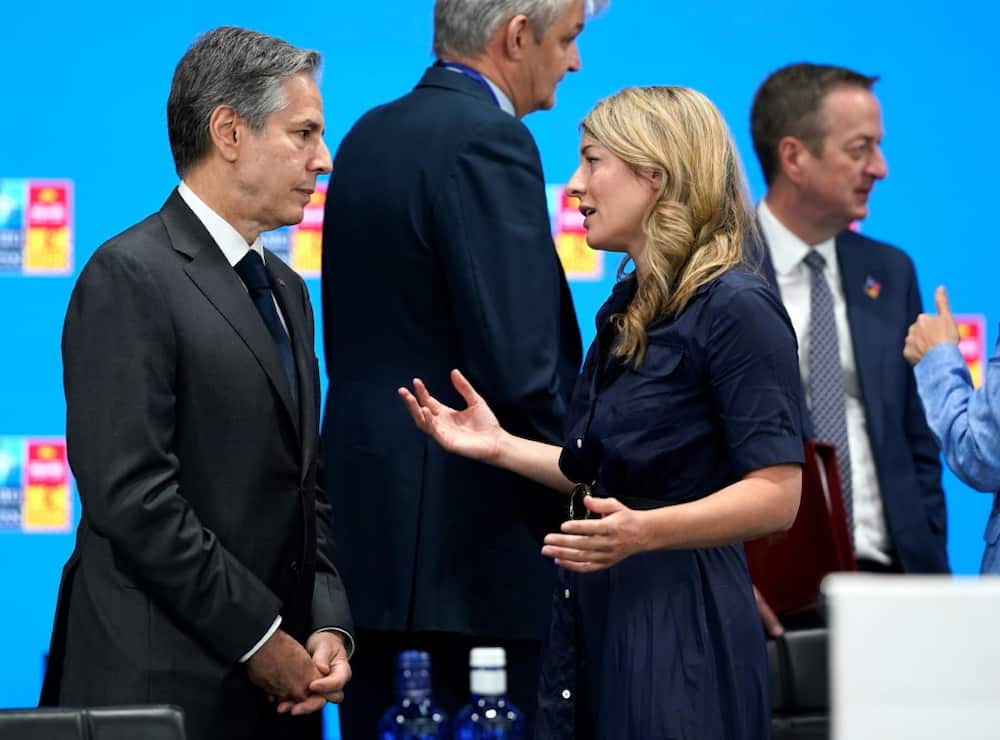 Canadian Foreign Minister Melanie Joly (R), seen here with US Secretary of State Antony Blinken in Madrid, announced the opening of four new embassies in Europe