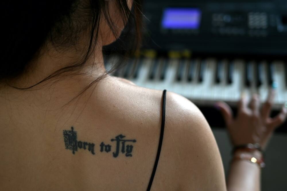 Agarwal sports a tattoo with the words "Born to Fly" on her shoulder blade