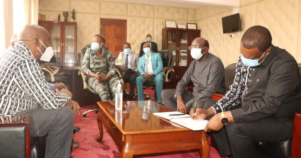 Justin Muturi signing visitors book in Makueni governor's office. Photo: Justine Muturi.