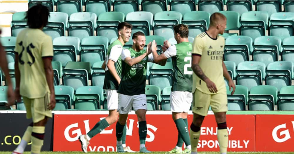 Hibernian players celebrate after scoring against Arsenal. Photo by Ian Rutherford.