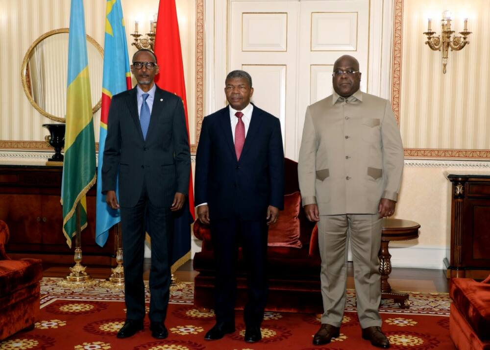 Rwanda President Paul Kagame (L), Angola President Joao Lourenco (C) and Democratic Republic of Congo President Felix Tshisekedi (R) met for talks in Luanda on July 6, 2022, after a surge in violence in eastern DRC