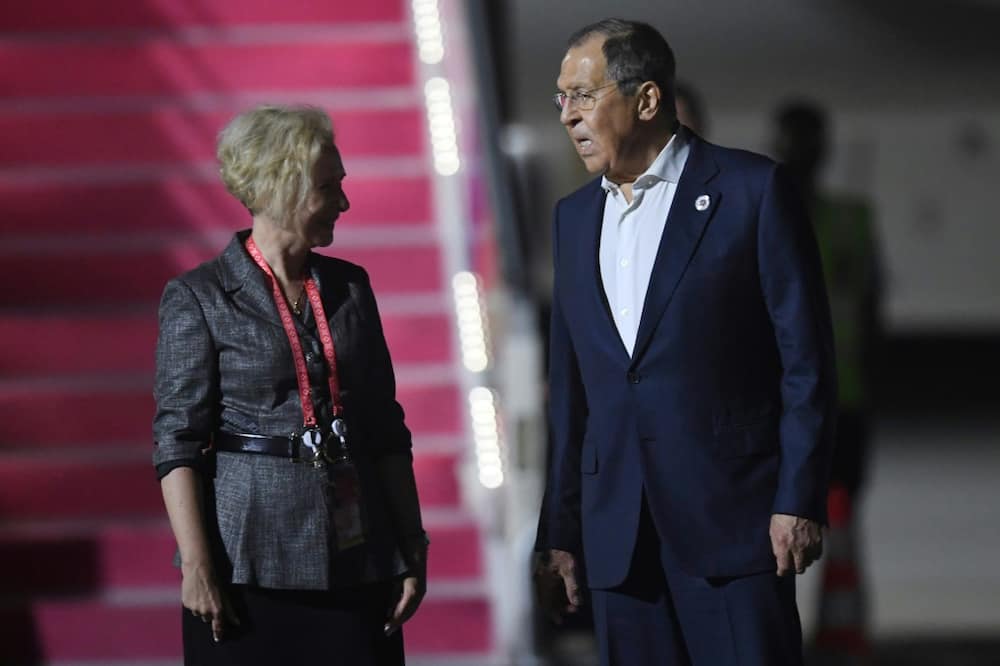 Russian President Vladimir Putin has been replaced at the G20 by Moscow's top diplomat Sergei Lavrov (R)