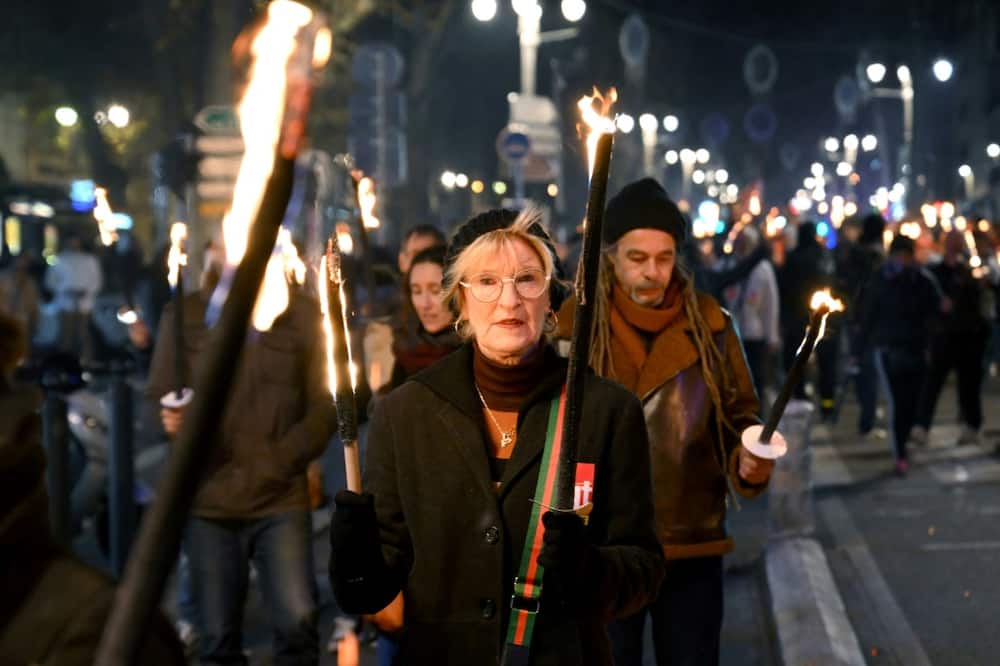 French protesters march against the pensions reform plan in the southern city of Marseille on January 17. A mass strike is planned for Thursday