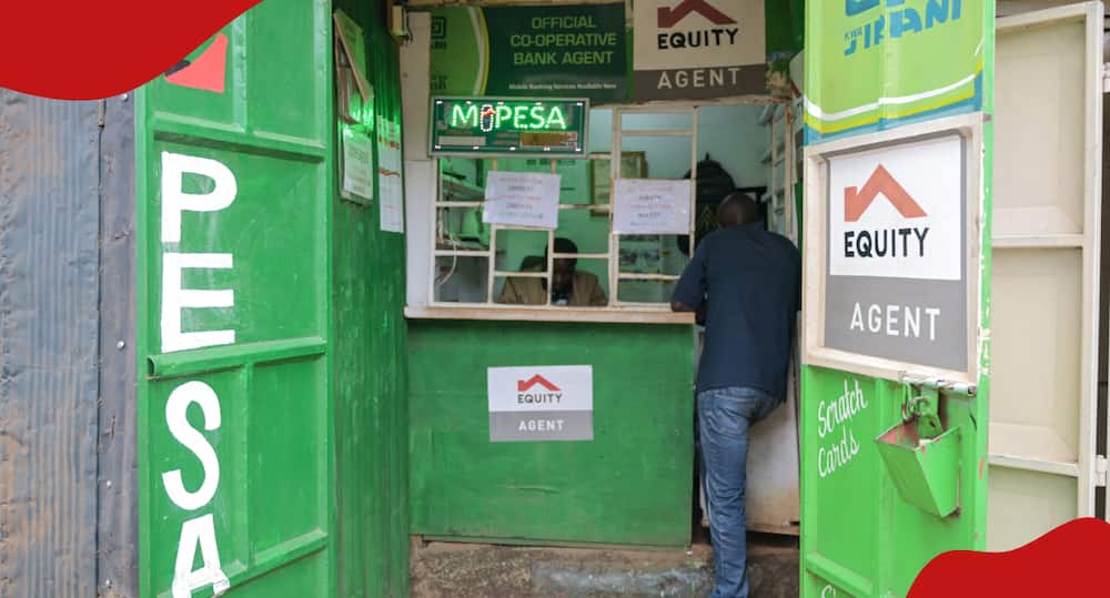 Customer makes transaction at an M-Pesa shop.