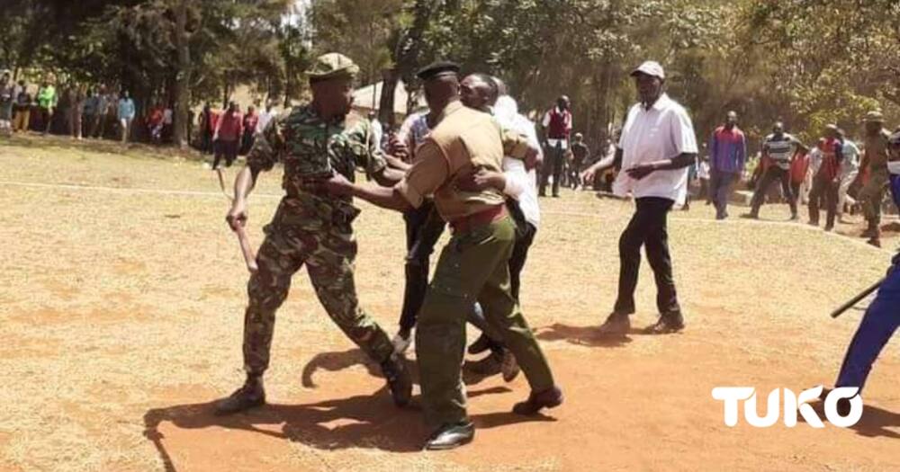 Scare in Bungoma as 2 Men Hang on Helicopter During Former MP John Serut's Burial.