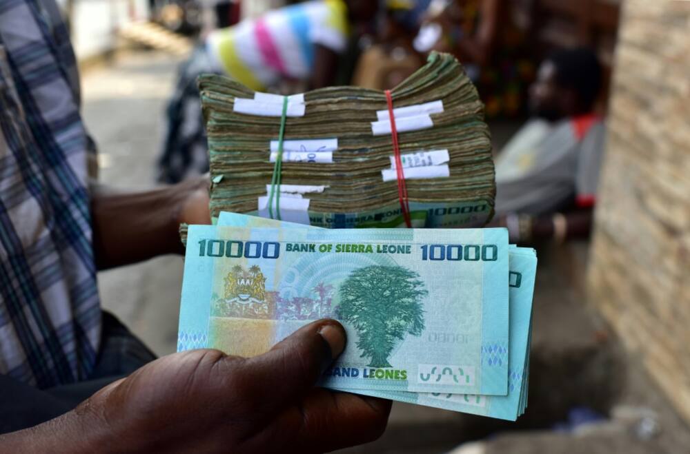 Bundles of old leone banknotes, which are being phased out by the revaluation scheme