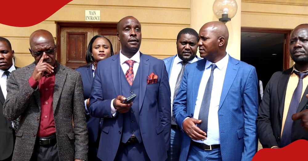 Boni Khalwale with his legal team led by Danstan Omari address the press at Milimani Law Courts.