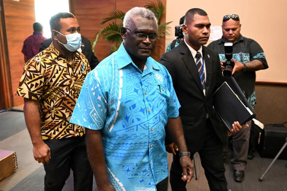 Solomon Islands Prime Minister Manasseh Sogavare (C) will host a high-level US delegation this weekend