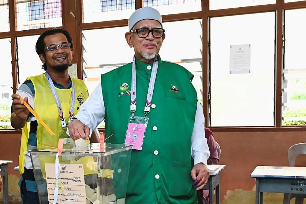 The conservative Pan-Malaysian Islamic Party (PAS), led by Abdul Hadi Awang (R), has made big gains in the latest election
