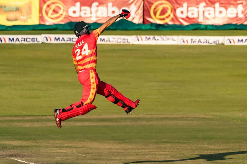 Sikandar Raza celebrates scoring a century for Zimbabwe during a one-day international against Bangladesh in Harare on August 5, 2022.