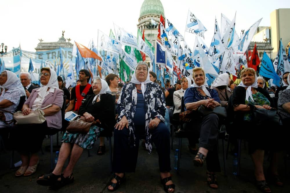 In this file photo taken on December 19, 2011, the president of the human rights organization Madres de Plaza de Mayo, Hebe de Bonafini (C), and other members of the association, are pictured during a gathering after the Argentine Congress recognized the group on its 35th anniversary, in Buenos Aires