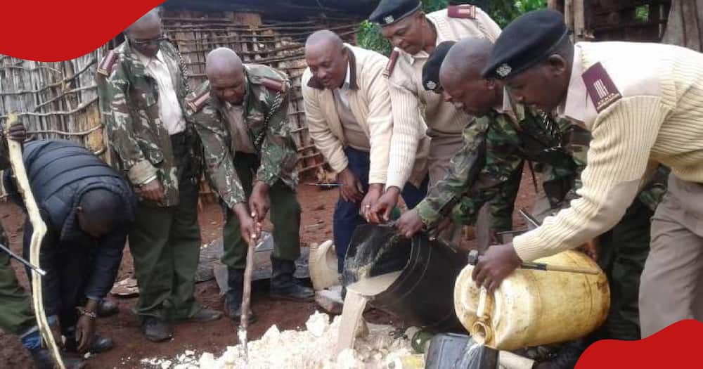 Local chiefs destroying illicit brew at a village in Kiambu.