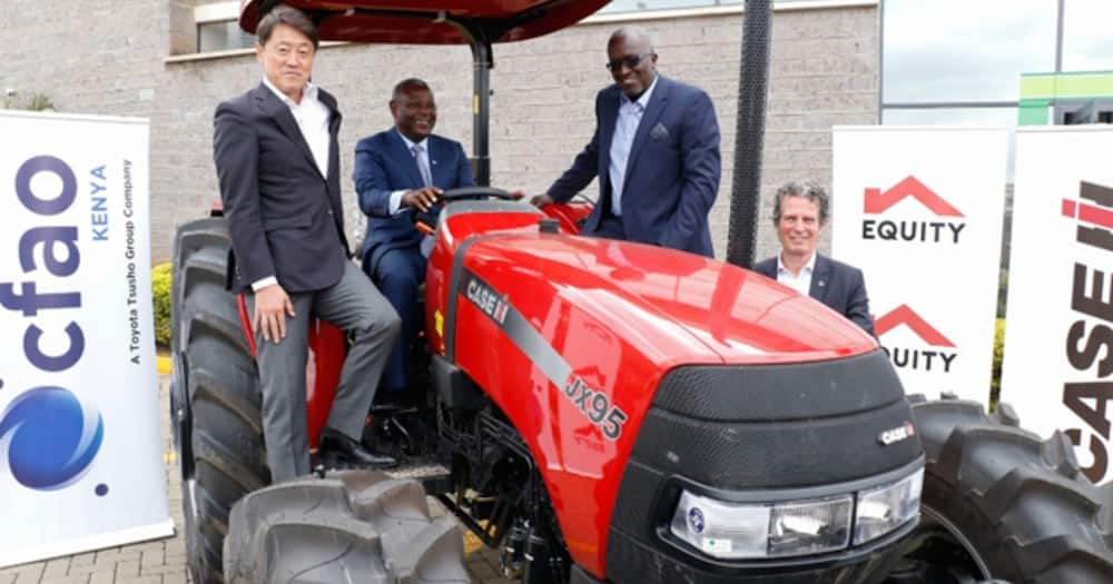 James Mwangi drives a tractor.