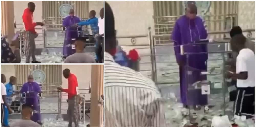 Reactions as young boys rain money on the altar, leaves priest confused in the video. @naijaloadedotng.