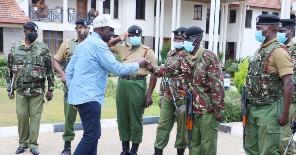 William Ruto greets members of his new security team.