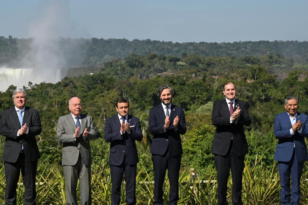 Uruguayan Foreign Minister Francisco Bustillo, Brazilian Foreign Minister Mauro Vieira, Governor of Misiones Oscar Herrera Ahuad, Argentine Foreign Minister Santiago Cafiero, Paraguayan Foreign Minister Julio Arriola and Bolivian Foreign Minister Rogelio Mayta at the Iguazu Falls in Argentina