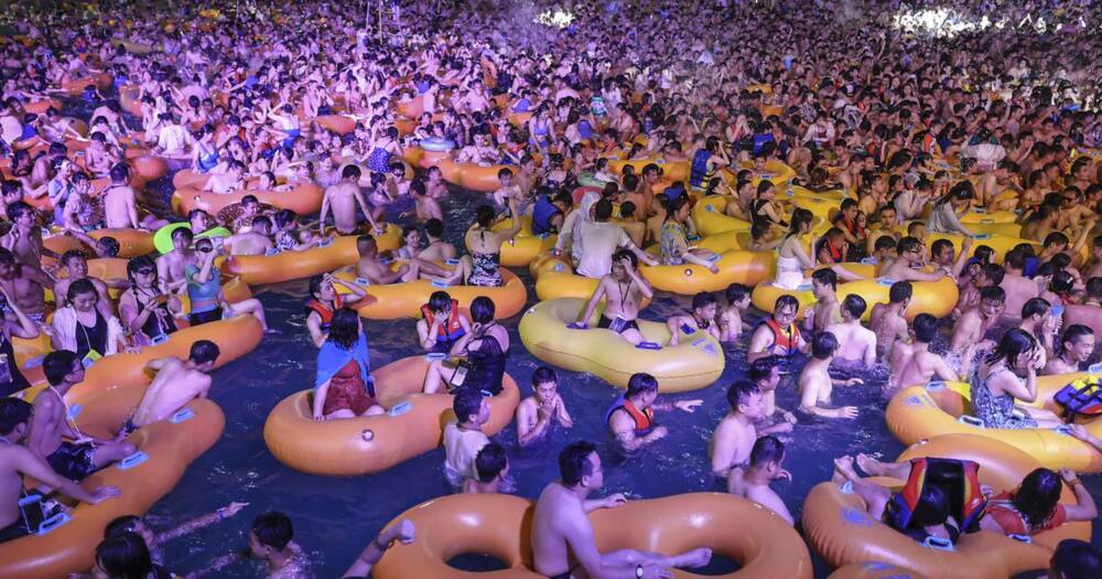 Wuhan wave: Chinese state media defend viral pool party images