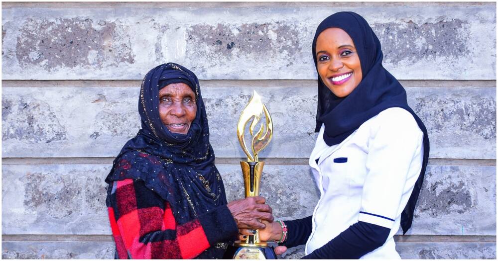 Qabale Duba shares trophy with mum.