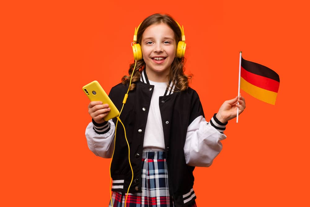 A girl is holding a German flag