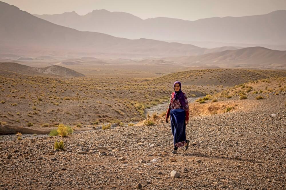 Amazigh woman Ida Ouchaali walks at an encampment near the village of Amellagou where Morocco's last nomads live