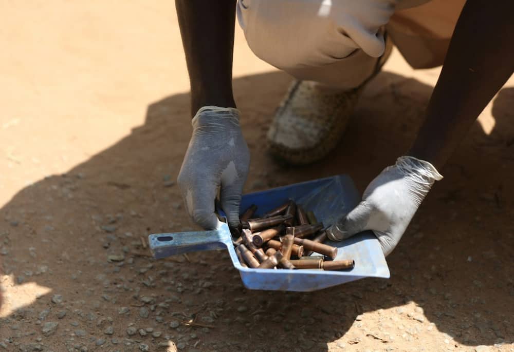 A forensic investigator gathered cartridges fired by the gunmen