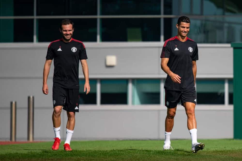 Juan Mata joined by Cristiano Ronaldo at Man United training ahead of Premier League resumption this weekend. Photo by Ash Donelon/Manchester United.
