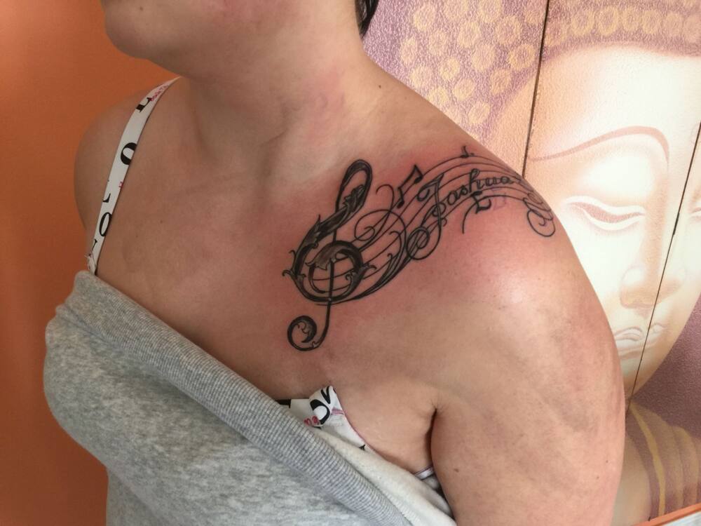 Women's music tattoo