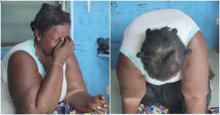 Ghanaian widow of three children breaks down in tears.