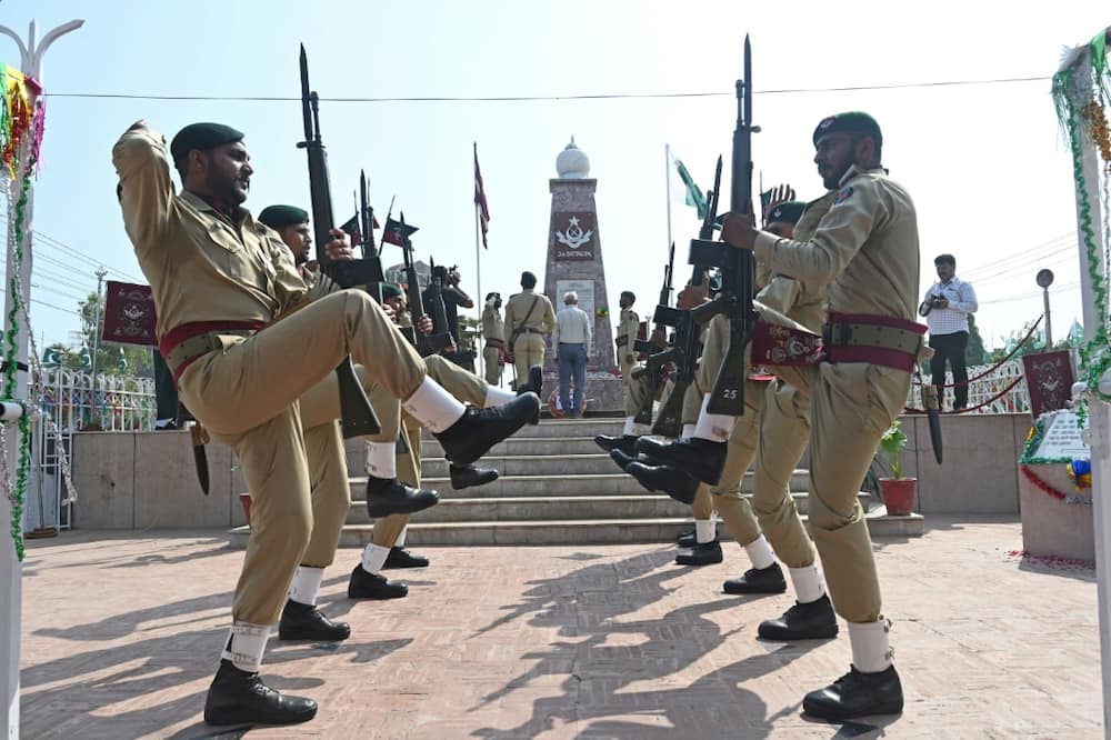 Pakistan soldiers pay tribute to their fallen comrades at a ceremony to mark Defence Day at Yadgar-e-Shuhada in Lahore