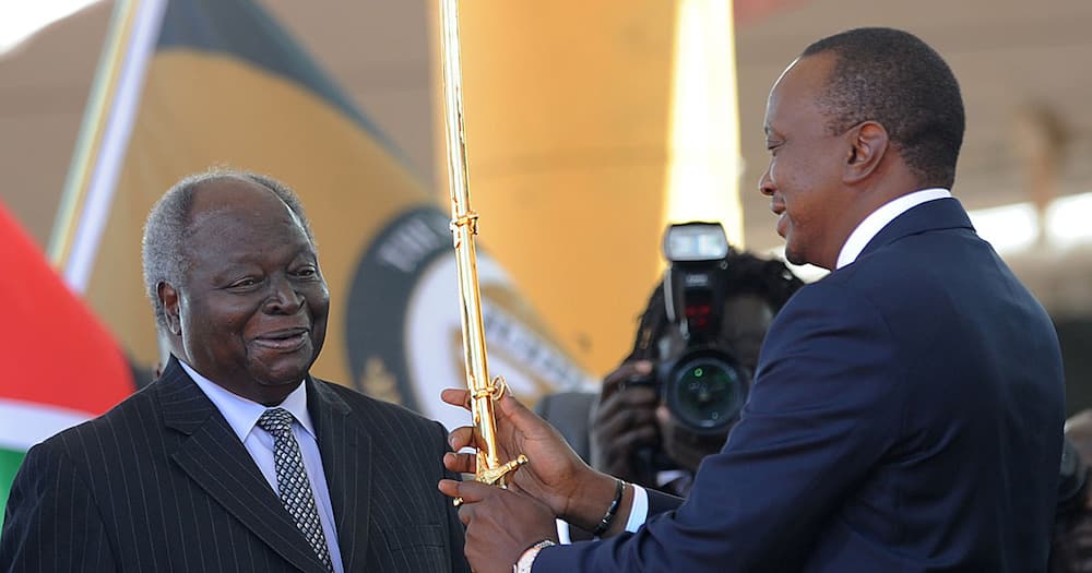 Mwai Kibaki handing power to President Uhuru Kenyatta.