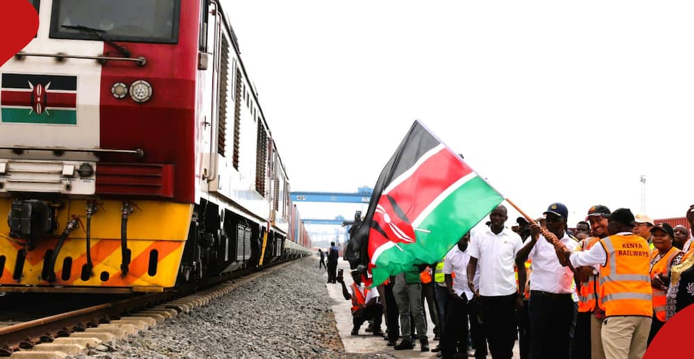 Kenyan government officials flag off new train wagons.